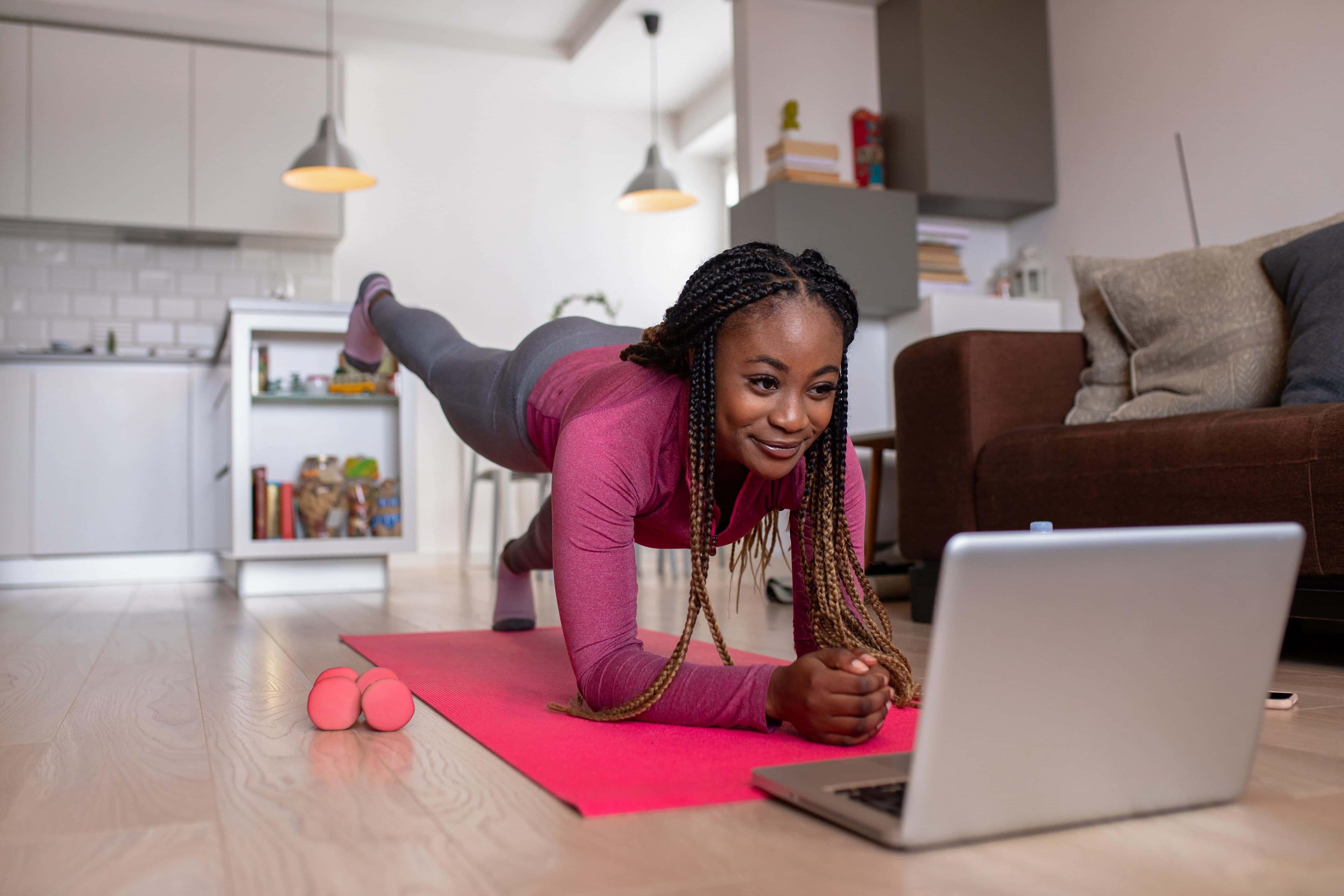 Lady in press up position whilst on a video session